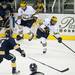 Michigan senior center Jeff Rohrkemper passes in the game against Windsor on Tuesday. Daniel Brenner I AnnArbor.com